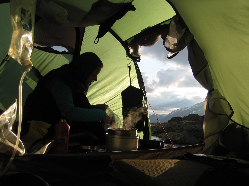 Cooking in the apse while camping in the wild.