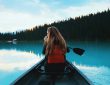 Basic paddling skills in Canada - woman in a boat on a lake.