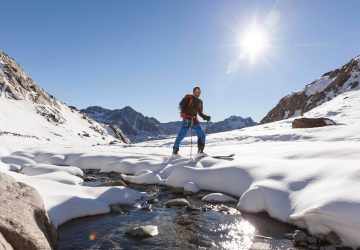 Ski touring for beginners 12 Ski touring for beginners - Ski tourer in the sunshine in the mountains.