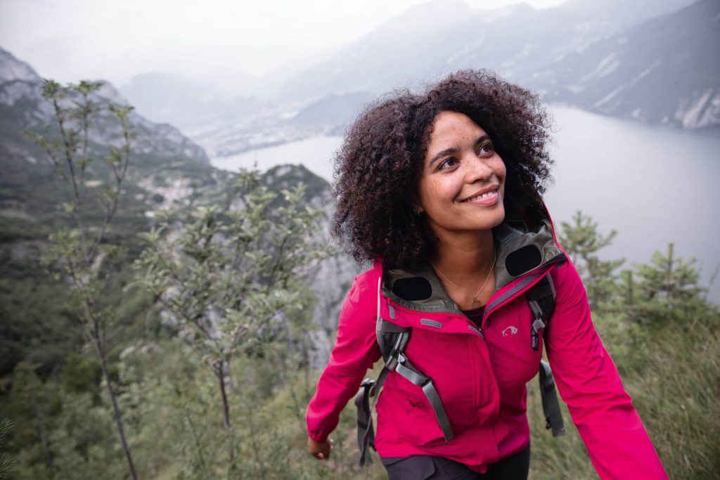 Hiking equipment 2 Woman with functional outdoor clothing while hiking.