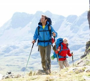 Outdoor apps 8 Outdoor apps: Two trekkers with GPS device.