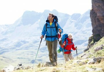 Outdoor apps 8 Outdoor apps: Two trekkers with GPS device.