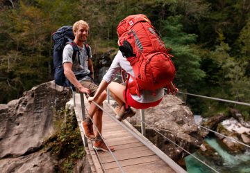 How to pack your backpack 14 How to pack your backpack: Two backpackers on a suspension bridge in the Soca Valley in Slovenia.