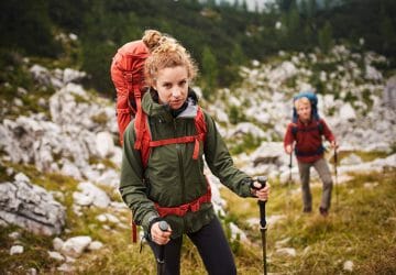 Hiking backpack or trekking backpack 2 Hiking backpack or trekking backpack - woman with a red Tatonka Yukon on her back.