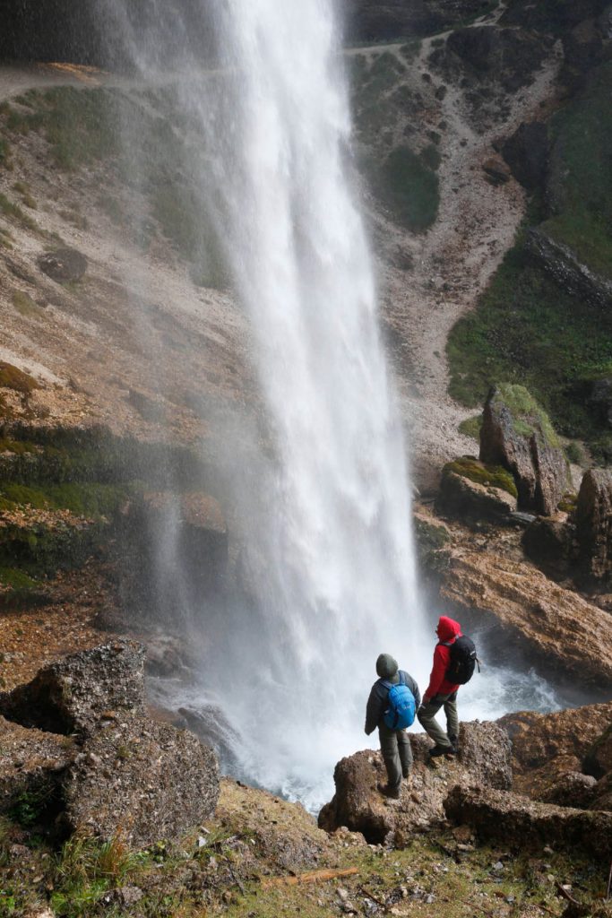 Backpacking hygiene 4 Two hikers at a waterfall.