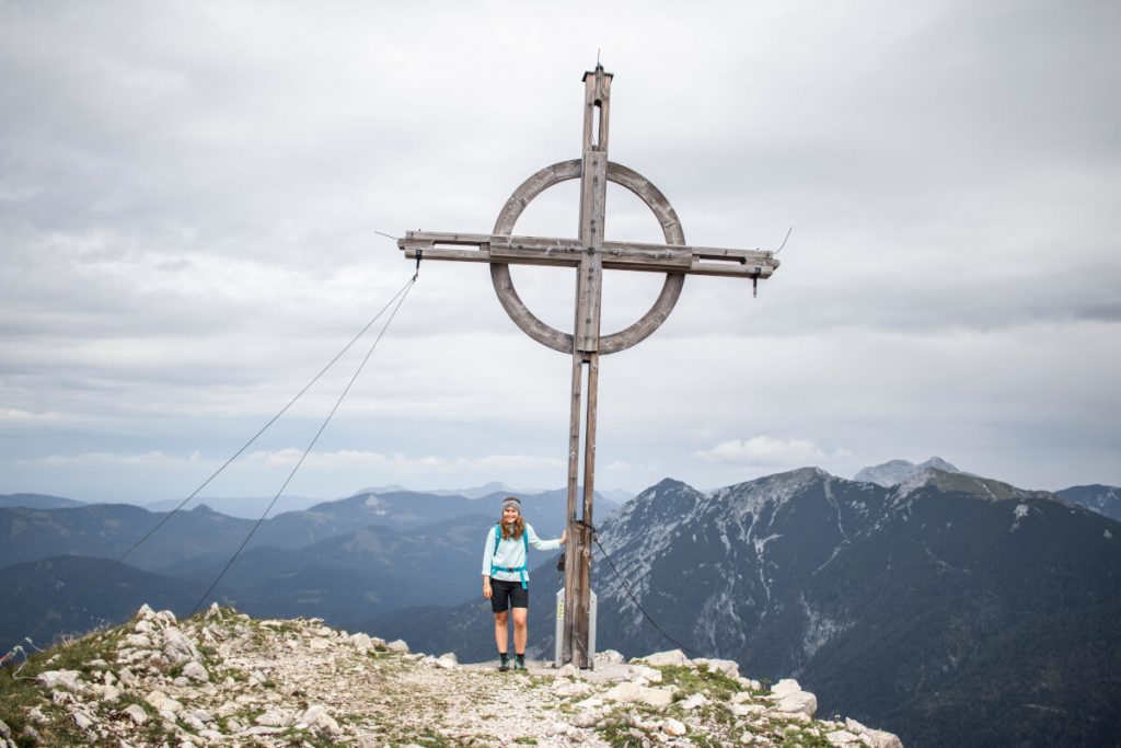 Maria next to the summit cross of Seekarspitze at Achensee.