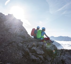 Overcoming fear of heights 5 Overcoming fear of heights: Two climbers sit on a rocky outcrop.