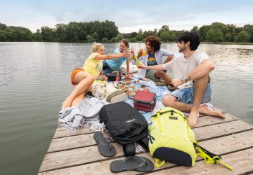 Beautiful lakes in Bavaria 16 Beautiful lakes in Bavaria: A group sitting on the jetty of a lake.