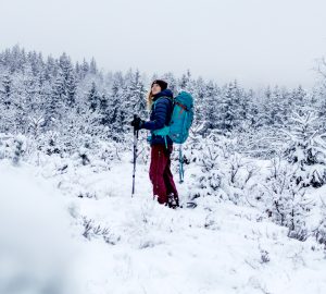 Winter trekking in Sweden 3 Winter trekking in Sweden: Franziska with her backpack in the snowy forests of Sweden.